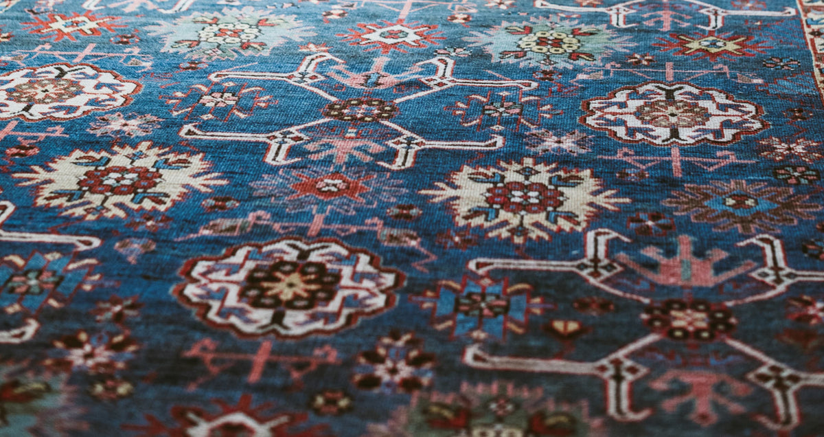 Multi-colour antique rug with intricate floral pattern